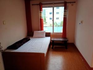 Postel nebo postele na pokoji v ubytování TM Guest House
