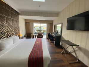 Ένα ή περισσότερα κρεβάτια σε δωμάτιο στο Luxury Inkari Hotel