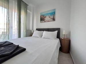 Katil atau katil-katil dalam bilik di Sea Breeze V Apartment +12 gambar