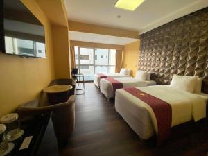 Ένα ή περισσότερα κρεβάτια σε δωμάτιο στο Luxury Inkari Hotel