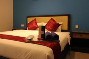 Ein Bett oder Betten in einem Zimmer der Unterkunft Royal Agate Beach Resort