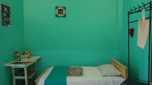 Postel nebo postele na pokoji v ubytování CANAAN MUSIC Hotel