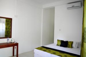 Postel nebo postele na pokoji v ubytování Pavana Resort