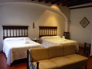 Voodi või voodid majutusasutuse Meson del Alferez Coatepec toas