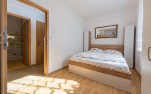 Postel nebo postele na pokoji v ubytování Apartmán Jonáš u pláže