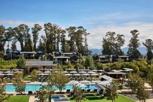 arial view of a resort with a pool and umbrellas at Stanly Ranch, Auberge Collection in Napa