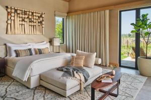 a bedroom with a large bed and a couch at Stanly Ranch, Auberge Collection in Napa +59 photos