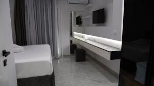 TV o dispositivi per l'intrattenimento presso Bar Restorant Hotel Rama