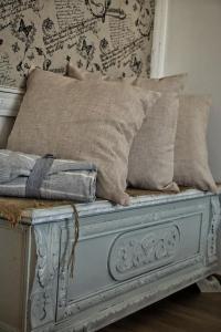 a bed with two pillows on top of it at CLavi Apartament in Sassari