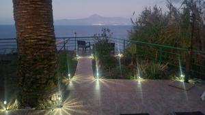 a patio with a view of the ocean at night at Los Cerrajones: spectacular views from the cliff in Agulo