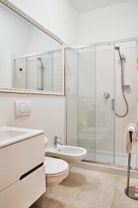 a bathroom with a toilet sink and a shower at Dormi da noi in Ancona