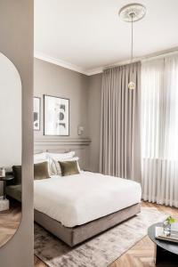 Letto o letti in una camera di Noel Suites