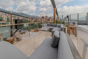 a living room with a view of a city at The Charlee Hotel in Medellín