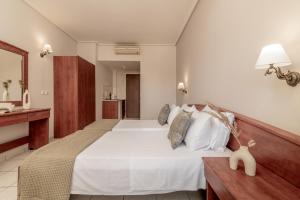 Postel nebo postele na pokoji v ubytování Daisy Hotel