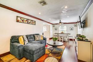 a living room with a couch and a table at Walk to Buckingham Farms Peaceful Fort Myers Home in Fort Myers