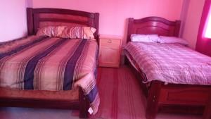 Postel nebo postele na pokoji v ubytování La Esperanza Carabuco