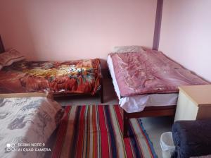 Postel nebo postele na pokoji v ubytování La Esperanza Carabuco + 24 fotografií