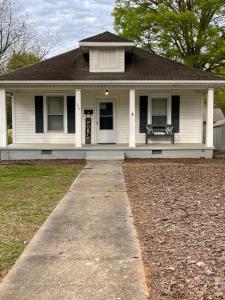 a white house with a pathway in front of it at Pet-Friendly 3BR Near Downtown - Deck - Backyard in Concord