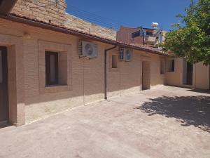 an empty parking lot in front of a building at Cottage in Anogyra in Anoyira