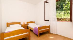 Postel nebo postele na pokoji v ubytování Apartments by the sea Prozurska Luka, Mljet - 617