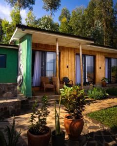 a house with plants in front of it at Khaya Nzuri Musanze in Gasanze