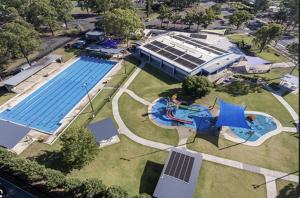 an overhead view of a swimming pool at a park at MJED House Australia in Ingleburn