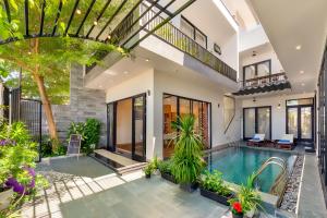 an image of a house with a swimming pool at U Maison by Class6 in Hoi An
