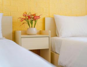 Postel nebo postele na pokoji v ubytování HOTEL NẮNG CHIỀU ĐÀ LẠT