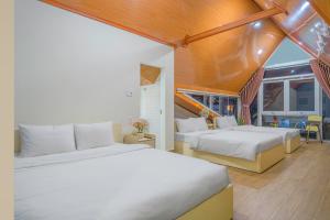 Postel nebo postele na pokoji v ubytování HOTEL NẮNG CHIỀU ĐÀ LẠT