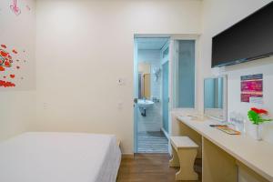Postel nebo postele na pokoji v ubytování HOTEL NẮNG CHIỀU ĐÀ LẠT