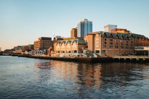 a group of buildings on the side of a river at Halifax Marriott Harbourfront Hotel in Halifax