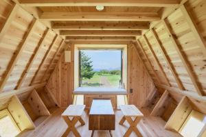 a room in a wooden cabin with a window at ist - Sado in Sado +22 photos