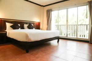 Postel nebo postele na pokoji v ubytování Hotel De Karon