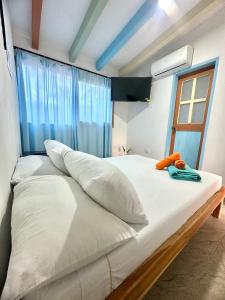 Postel nebo postele na pokoji v ubytování Hotel Bosque Blue