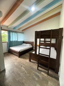Postel nebo postele na pokoji v ubytování Hotel Bosque Blue
