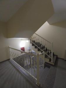 a view of a staircase in a house at Sweet studio with all amenities in Batumi +1 photo