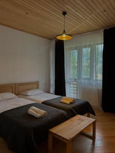 Postel nebo postele na pokoji v ubytování Beko’s garden Inn