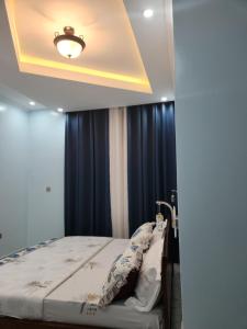 Ένα ή περισσότερα κρεβάτια σε δωμάτιο στο Care house