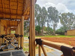 an outside view of a house under construction at Hampi One Love in Hampi