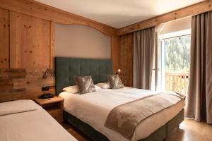 Voodi või voodid majutusasutuse Hotel Aurora toas