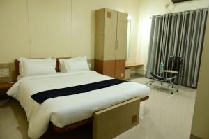 Postel nebo postele na pokoji v ubytování Hotel Matrix Inn Chakan