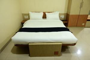 Postel nebo postele na pokoji v ubytování Hotel Matrix Inn Chakan