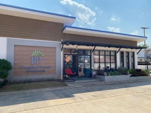 a front entrance to aventura resort with a sign on it at PP Nongkhai Resort in Nong Khai