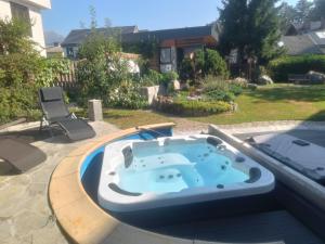 a jacuzzi tub on top of a patio at ArtRock Studio in Radovljica