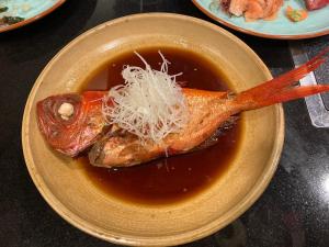 a bowl of soup with meat and noodles on it at StellaMarina~海の星　ATAMI in Shimo-taga