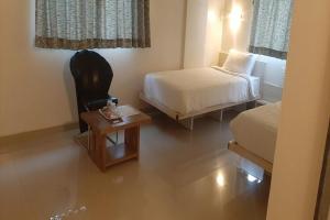 Postel nebo postele na pokoji v ubytování Hotel Matrix Inn Chakan