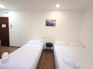 Shoreline Guesthouse 海岸线客栈客房内的一张或多张床位