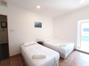 Shoreline Guesthouse 海岸线客栈客房内的一张或多张床位