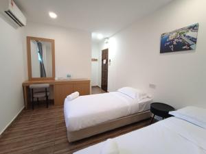 Shoreline Guesthouse 海岸线客栈客房内的一张或多张床位
