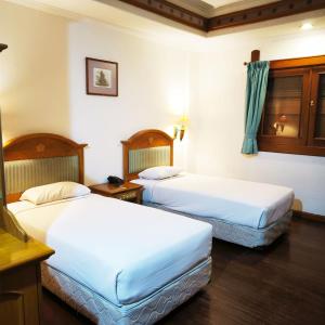 Kresna Hotel房間的床